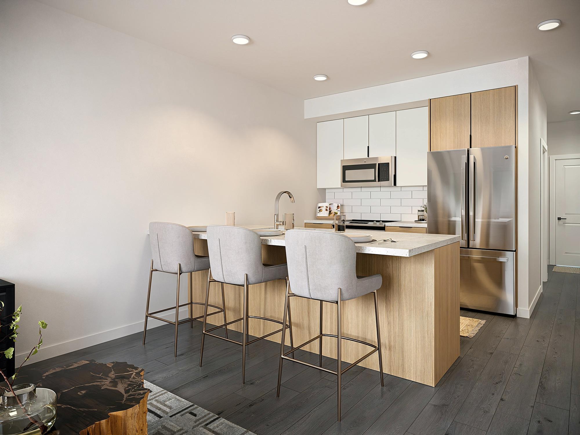 A kitchen with a bar stool and a counter.