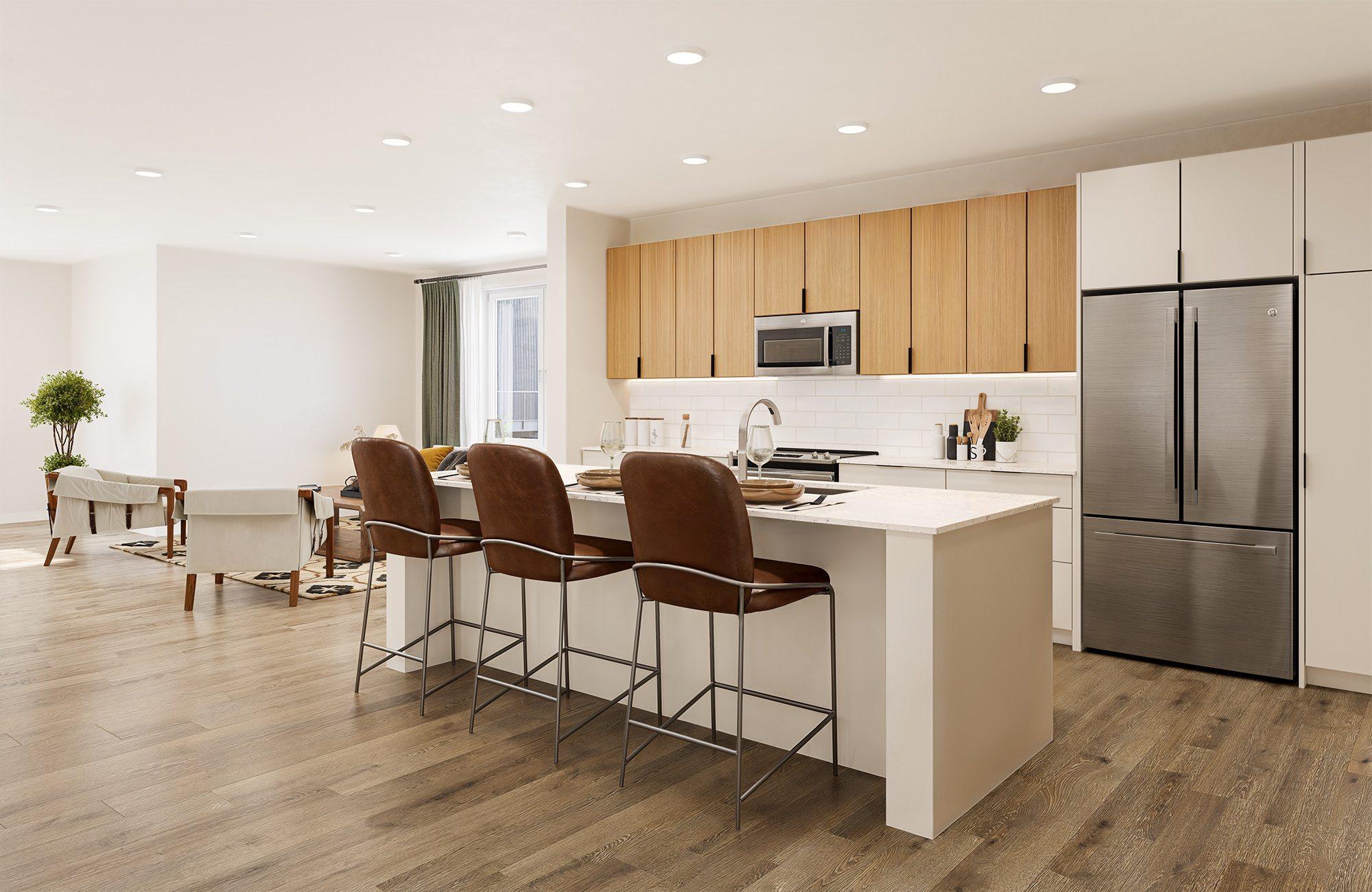 A modern kitchen with a white island and brown chairs.