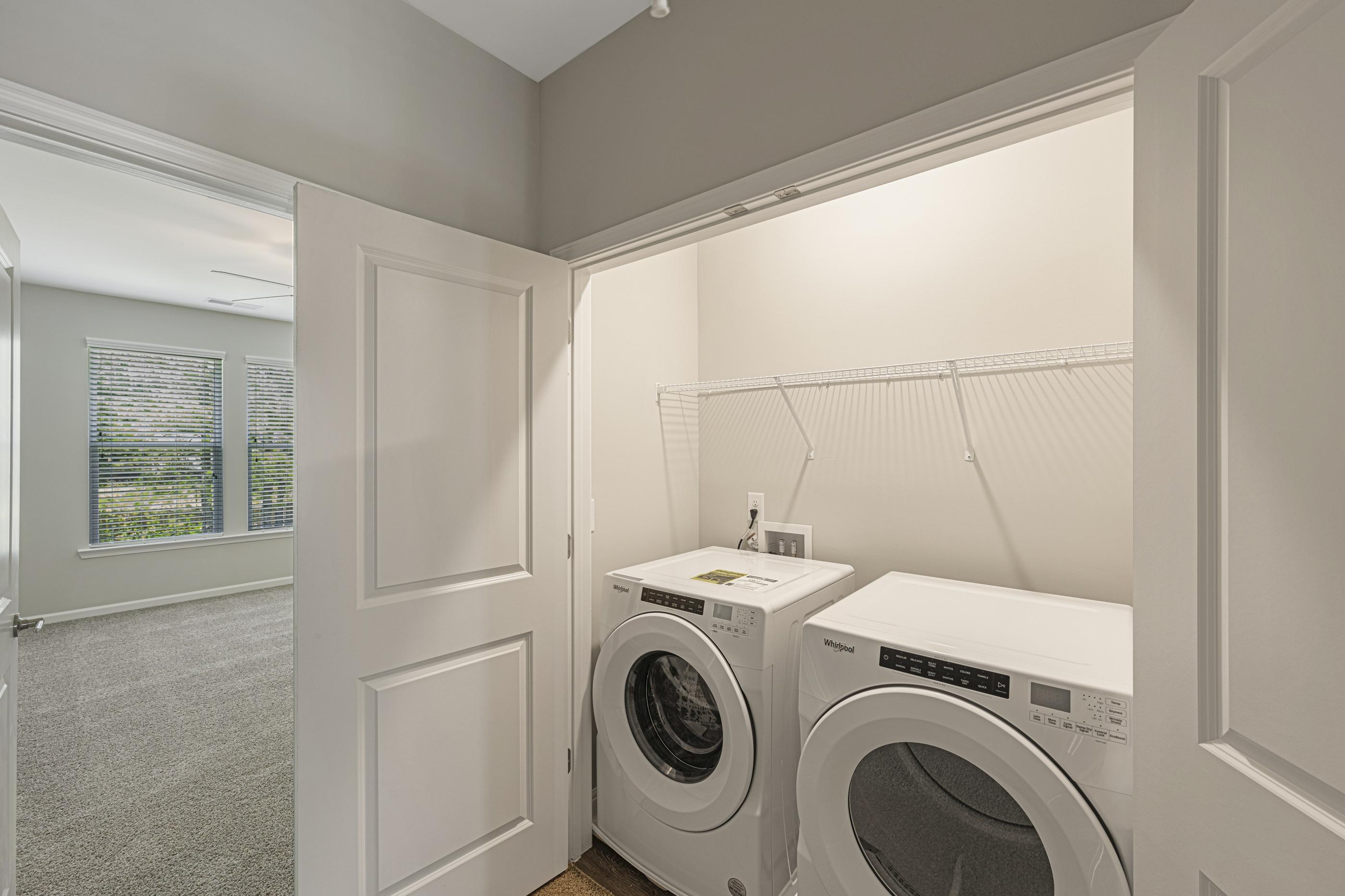 A laundry room with a washer and dryer.