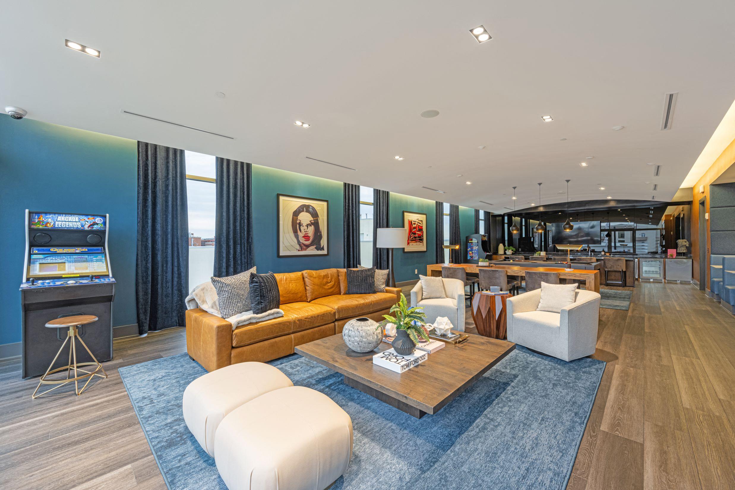 a living room with blue walls and a yellow couch