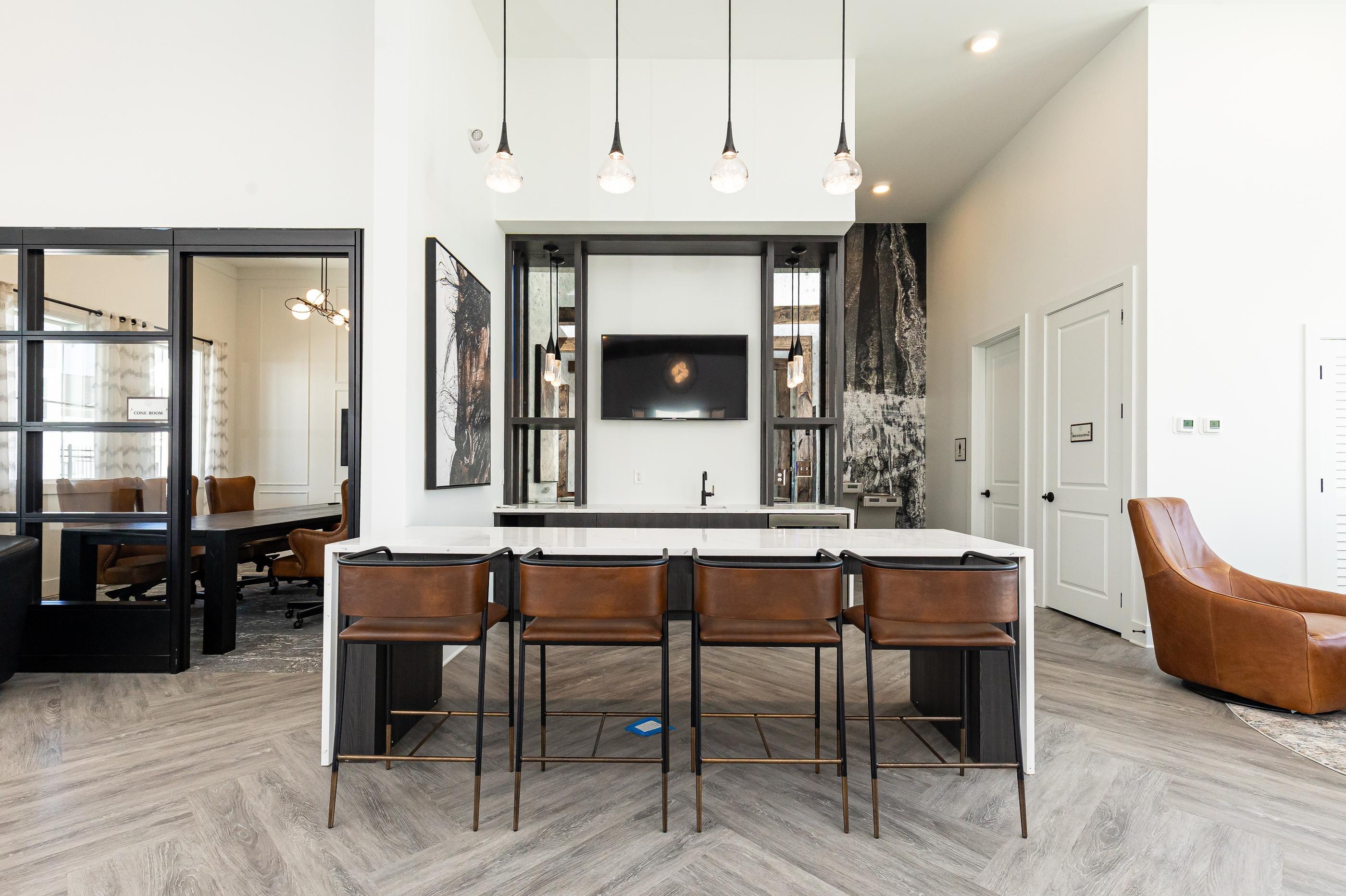 A modern living room with a fireplace and a dining table.