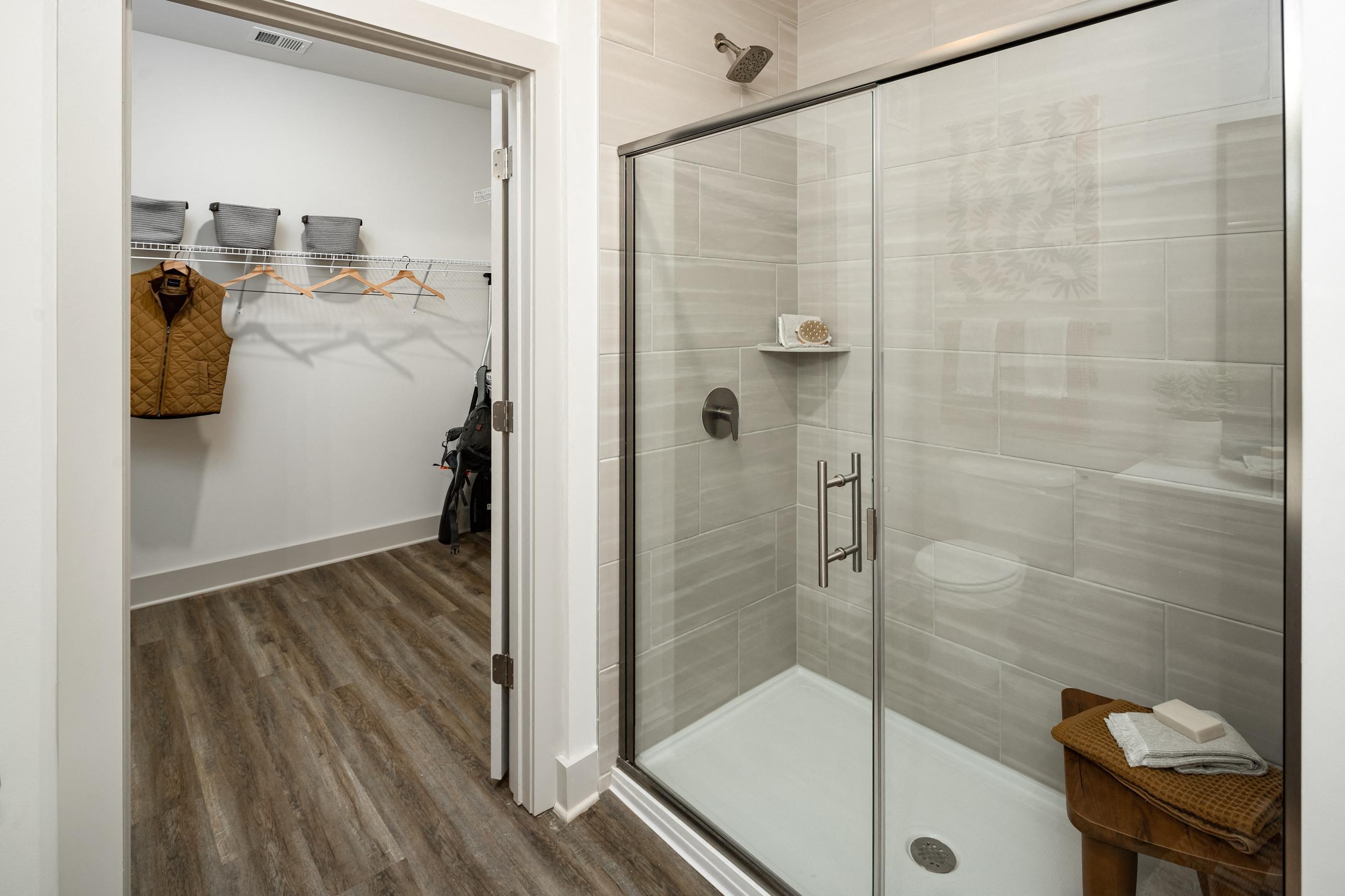 a shower with a glass door in a bathroom