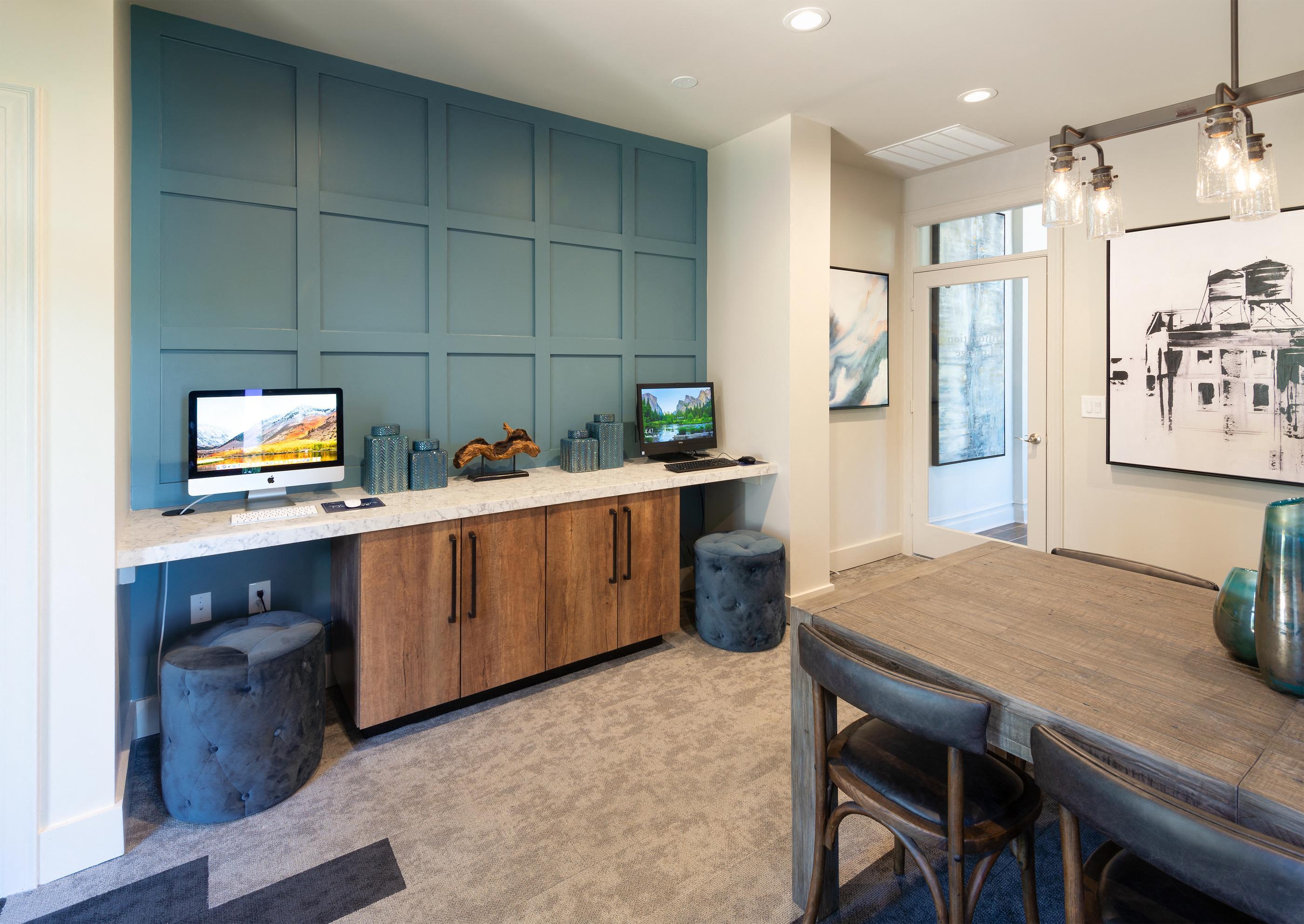 a kitchen and dining room with a table and chairs and a tv