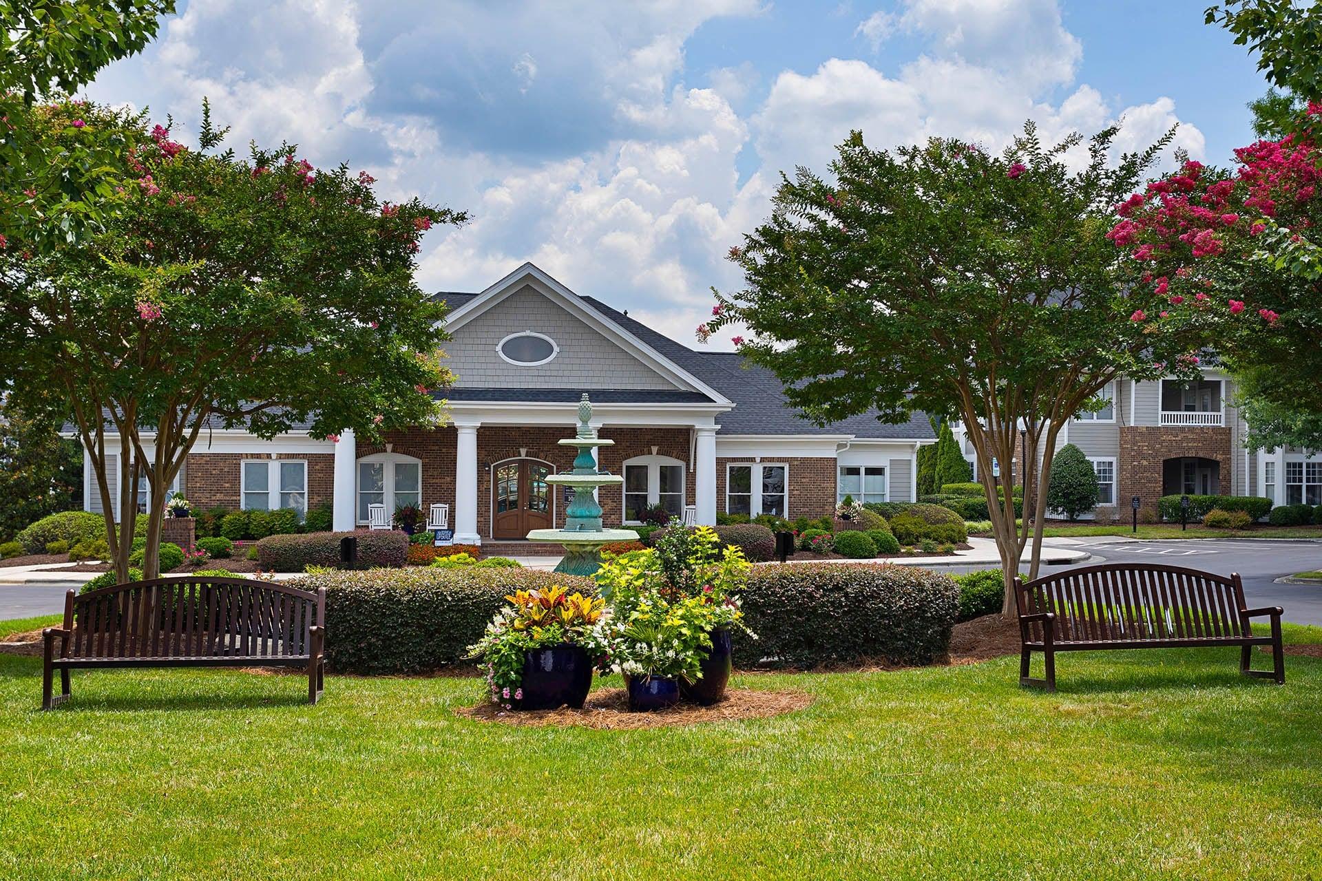 A building with a green lawn in front of it.