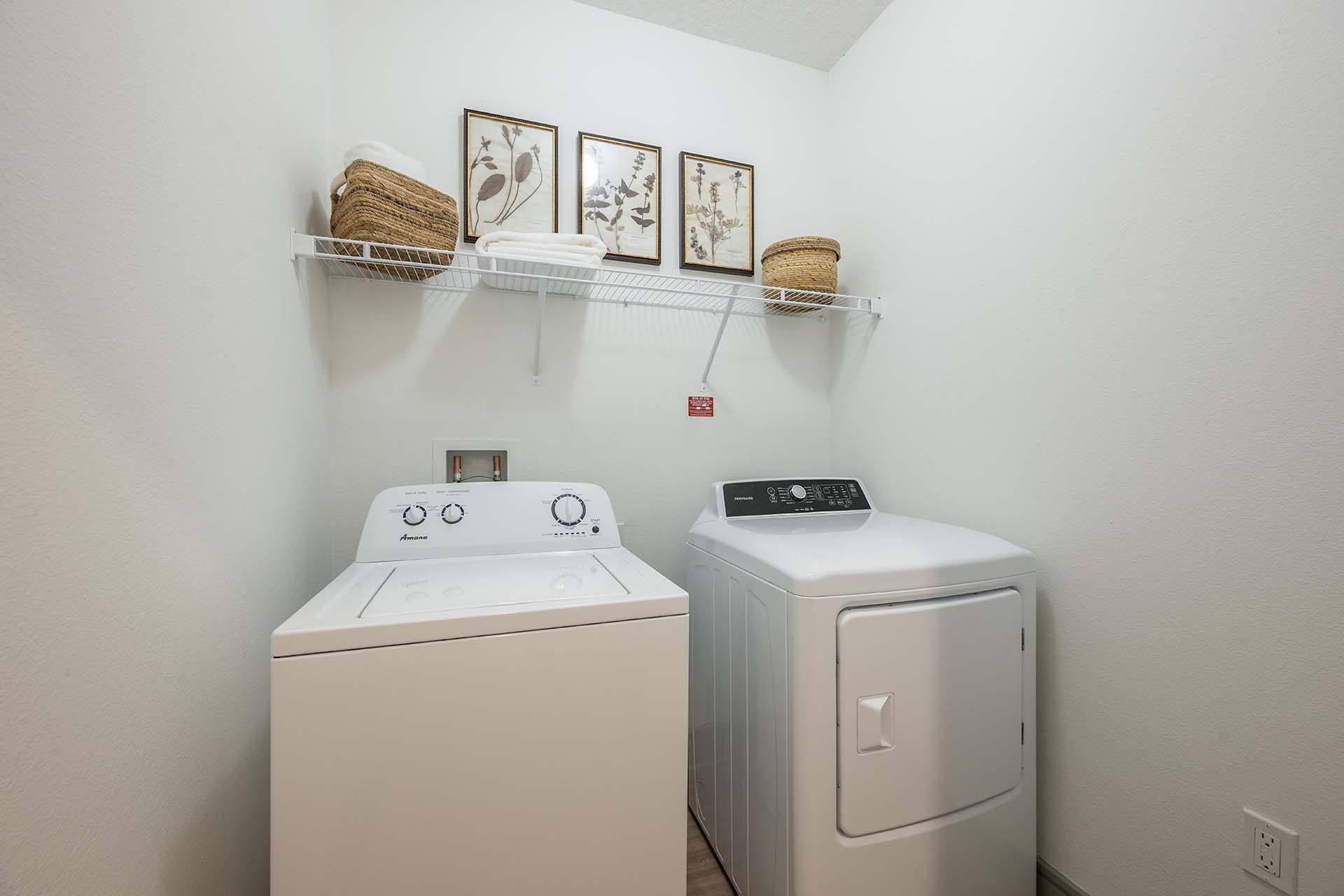 A laundry room with a washer and dryer.