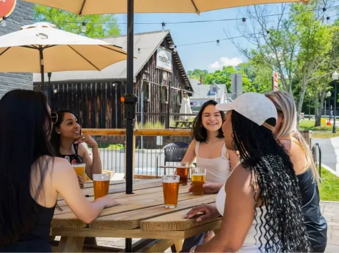 People relaxing at a community table