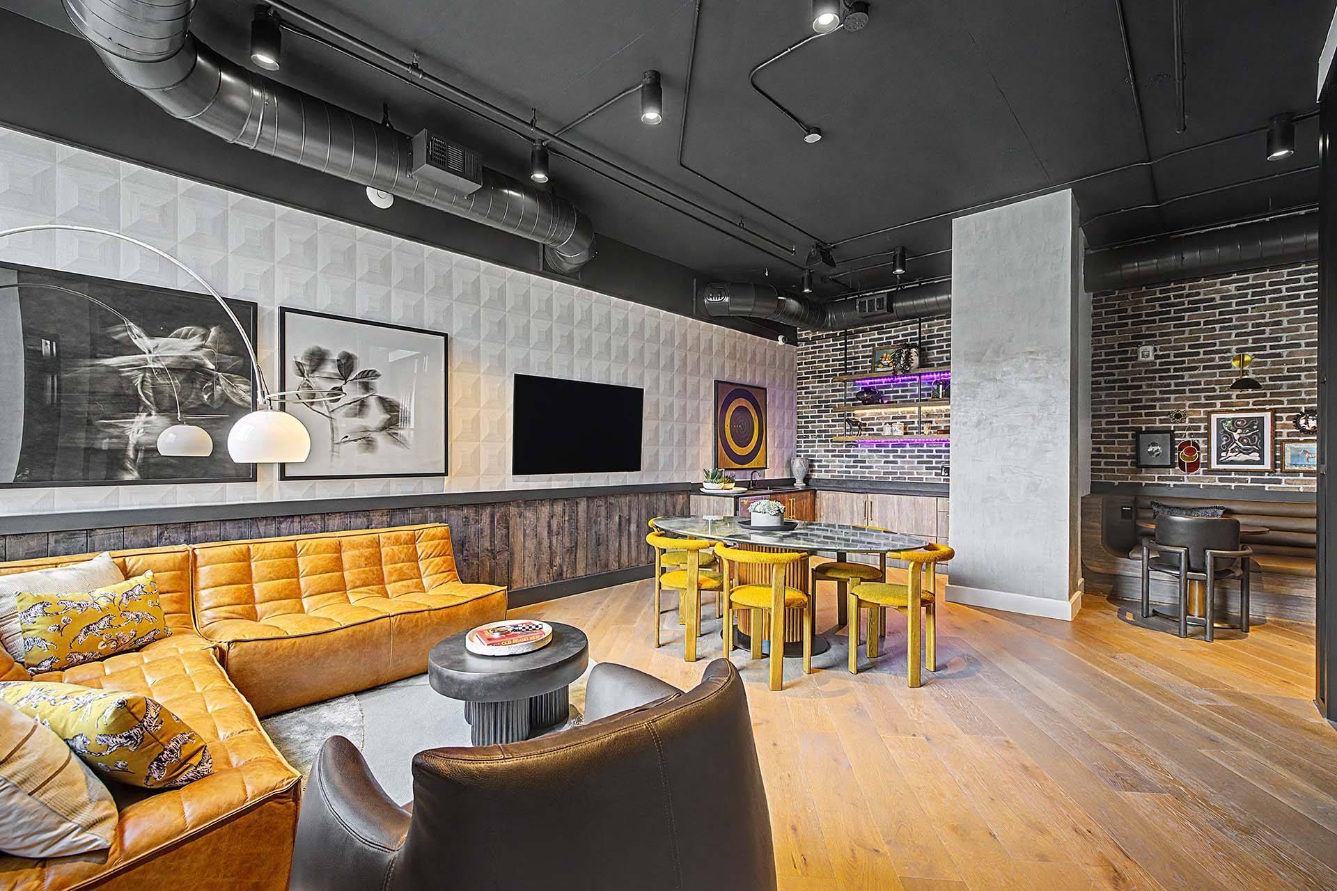 A modern living room with a yellow sofa and a wooden table.