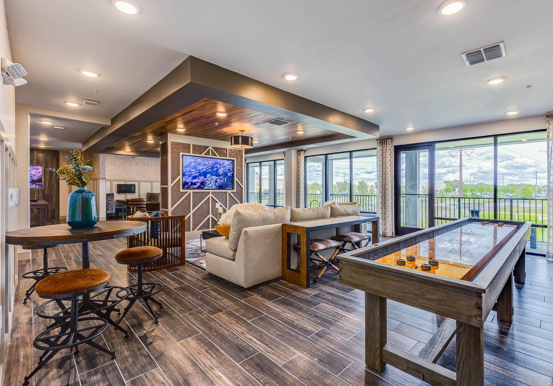 a game room with a pool table and a bar