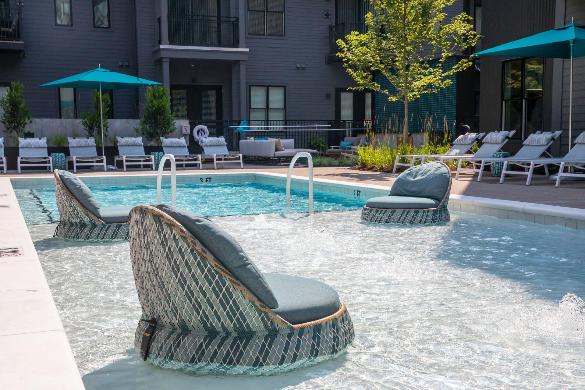 A pool with a chair in the middle of it.