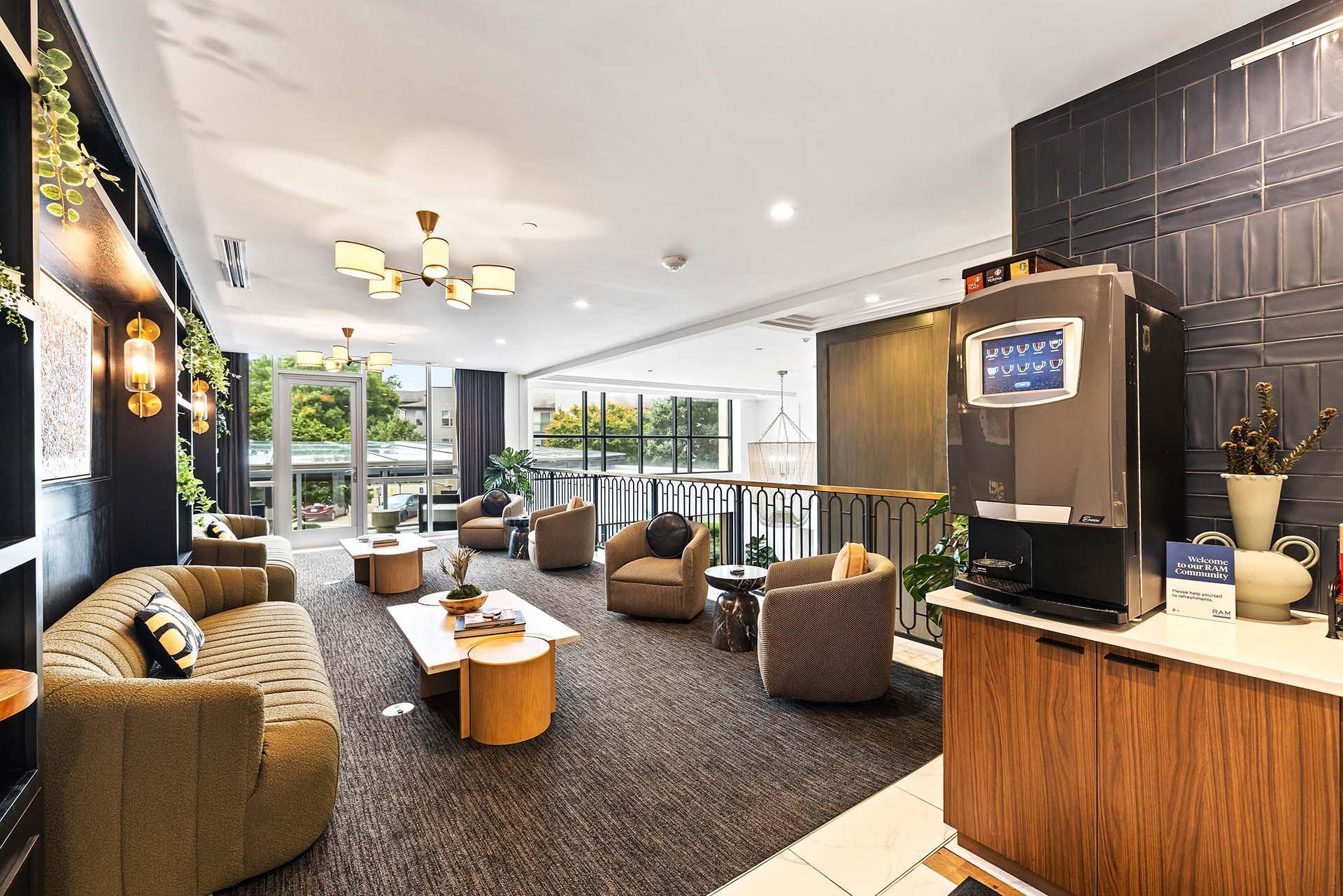 A modern living room with a balcony overlooking the outdoors.