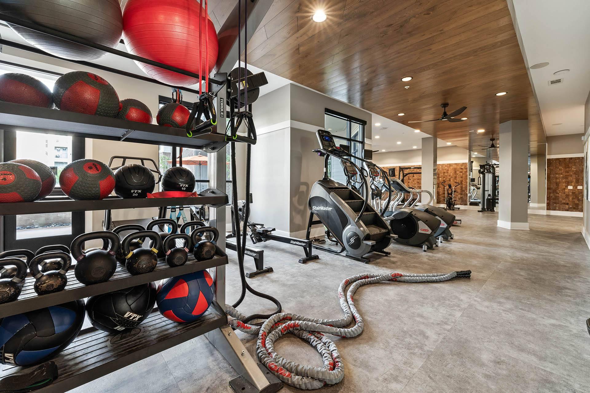 the gym is stocked with weights and other exercise equipment