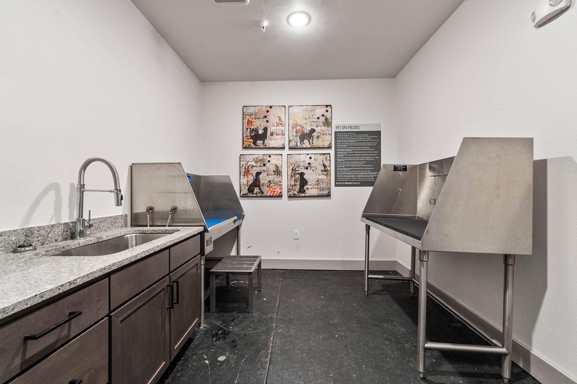 a kitchen with two stainless steel sinks and a counter top