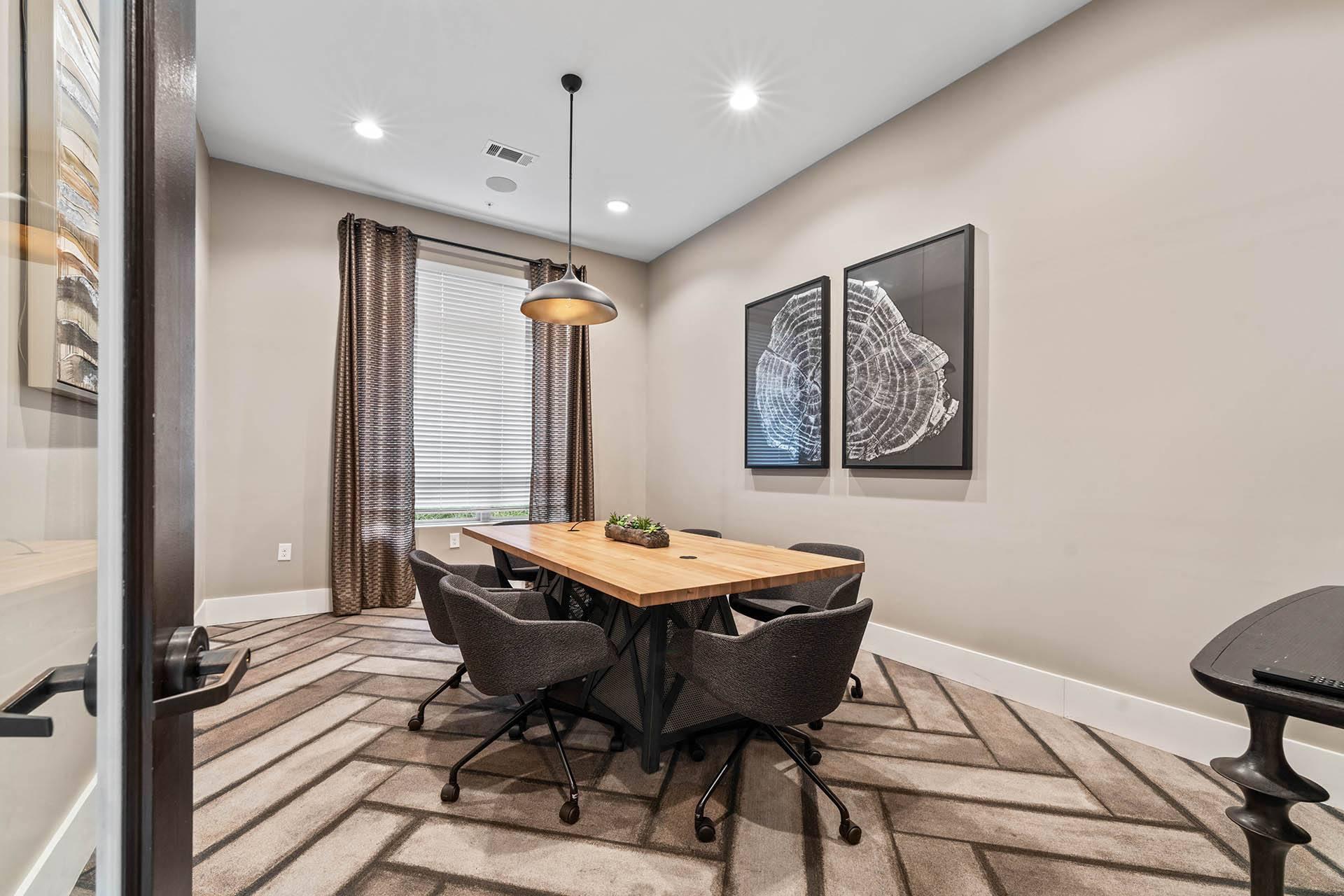 a dining room with a table and chairs