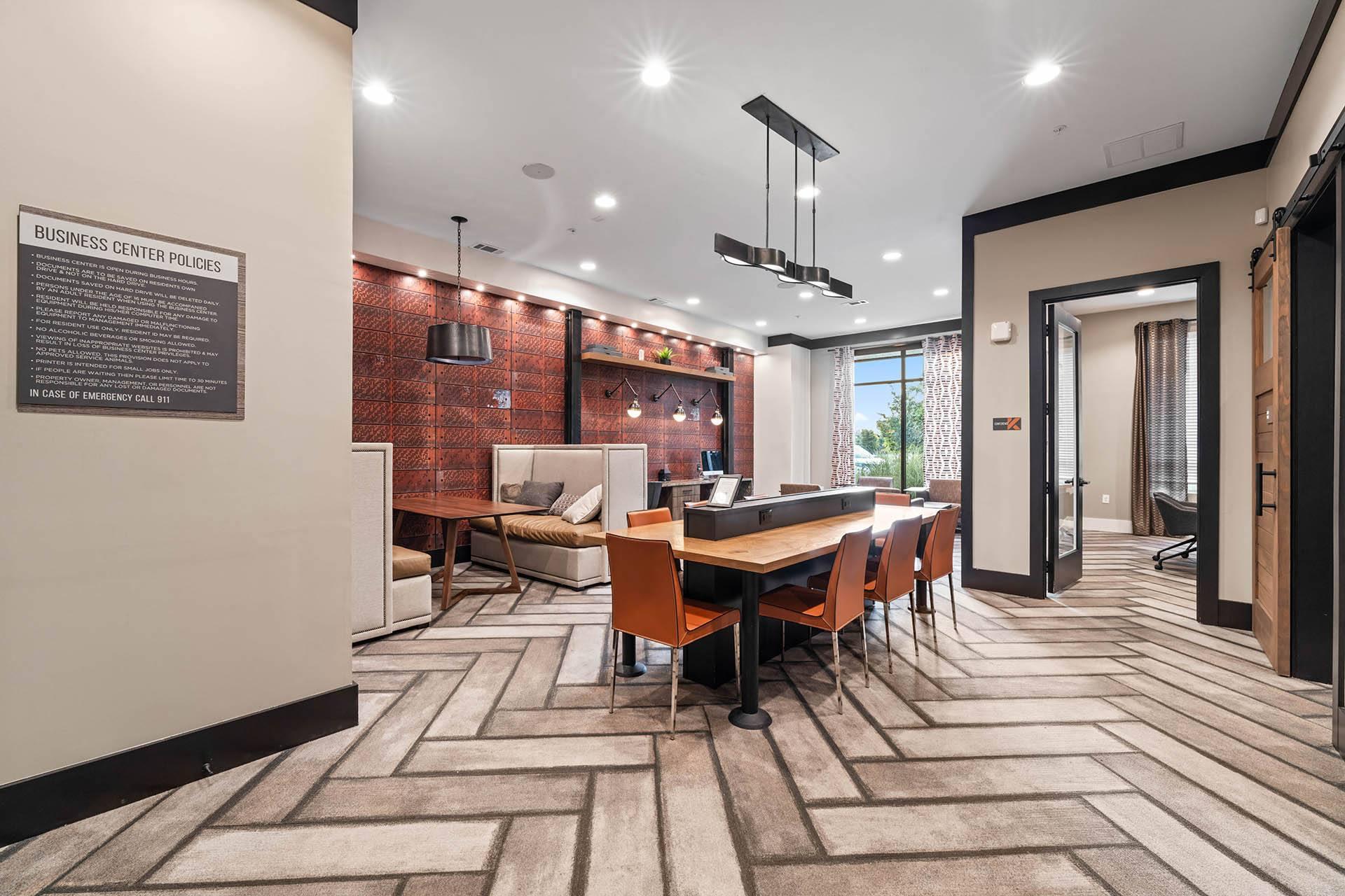a dining room with a table and chairs