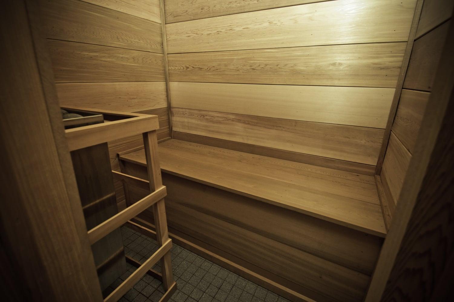 A wooden staircase with a tiled floor.