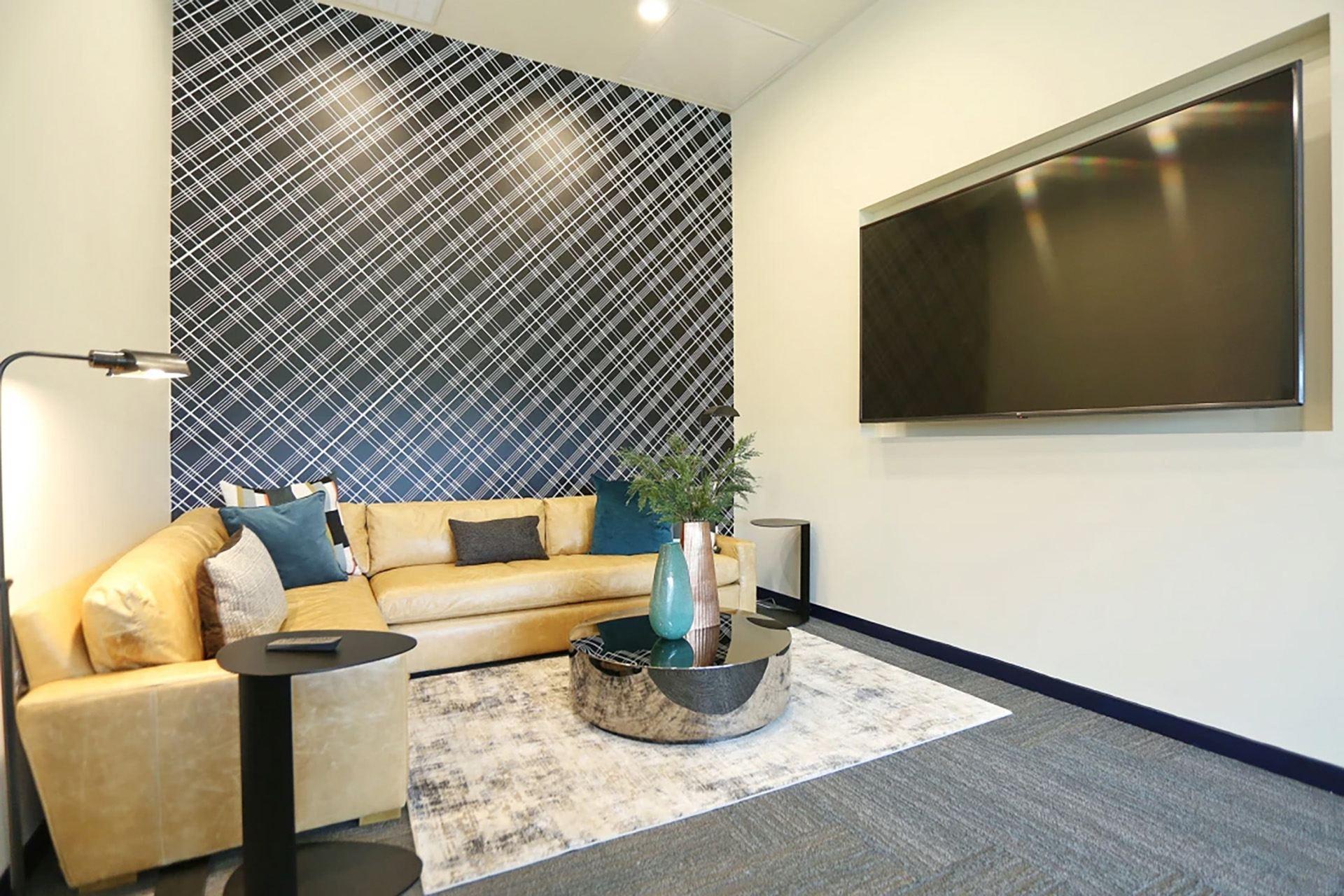 a living room with a couch and a television