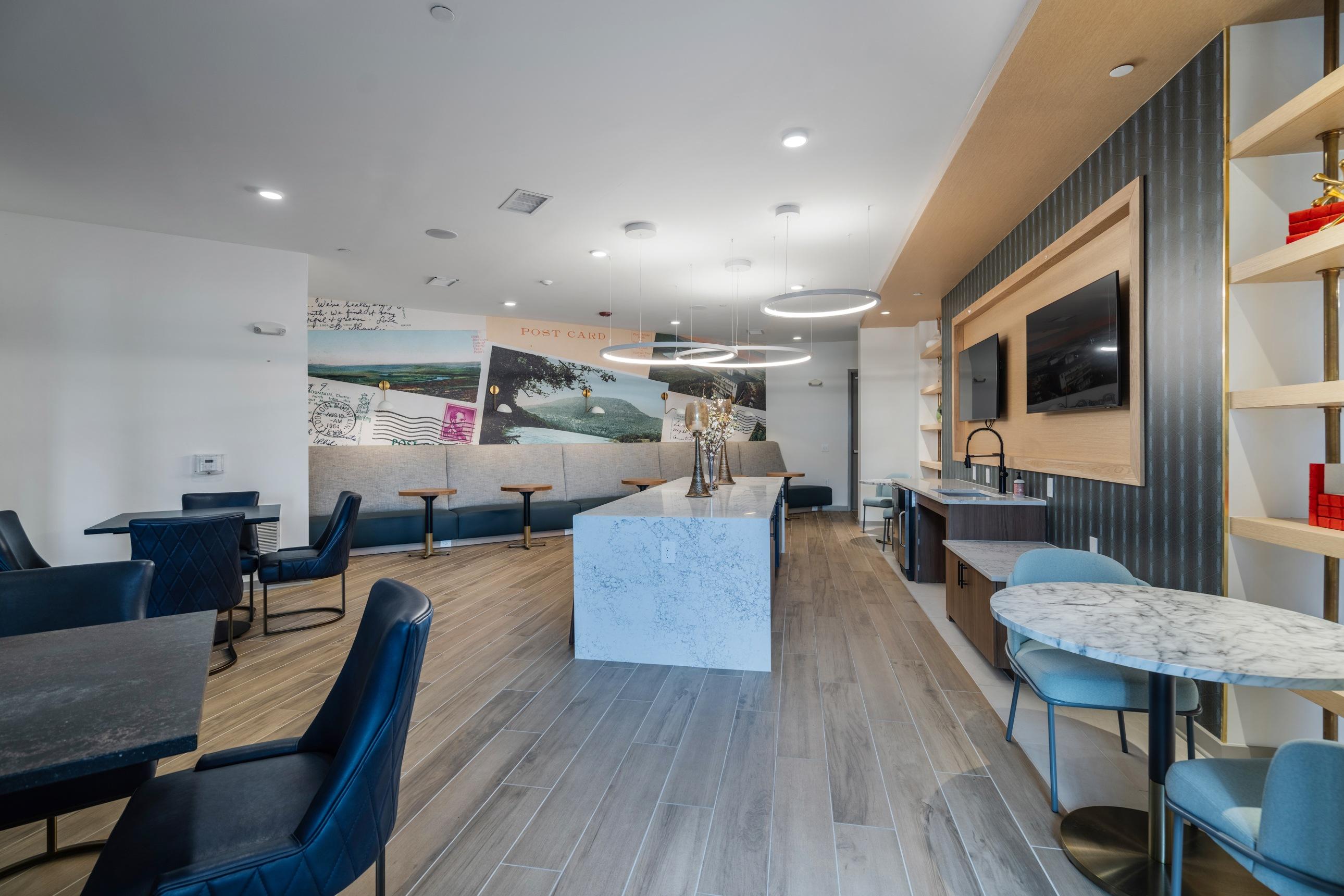 A modern dining area with a white marble table in the center.
