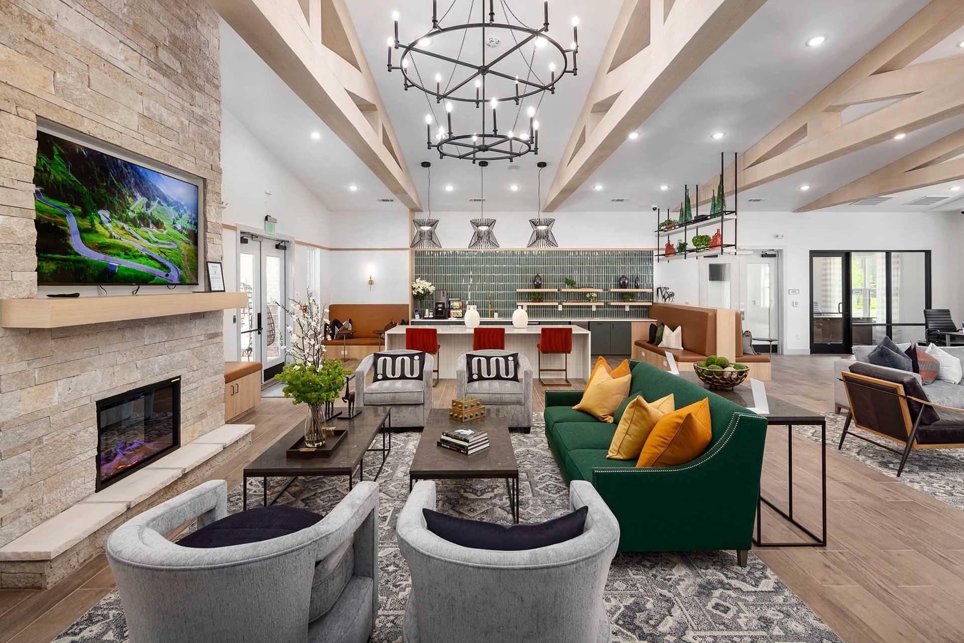a living room with couches and chairs and a fireplace