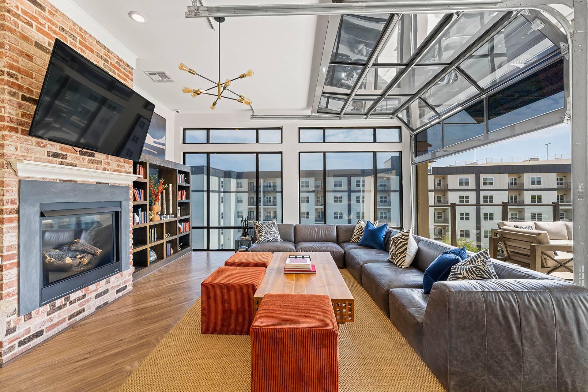 a living room with a couch and a television and a fireplace