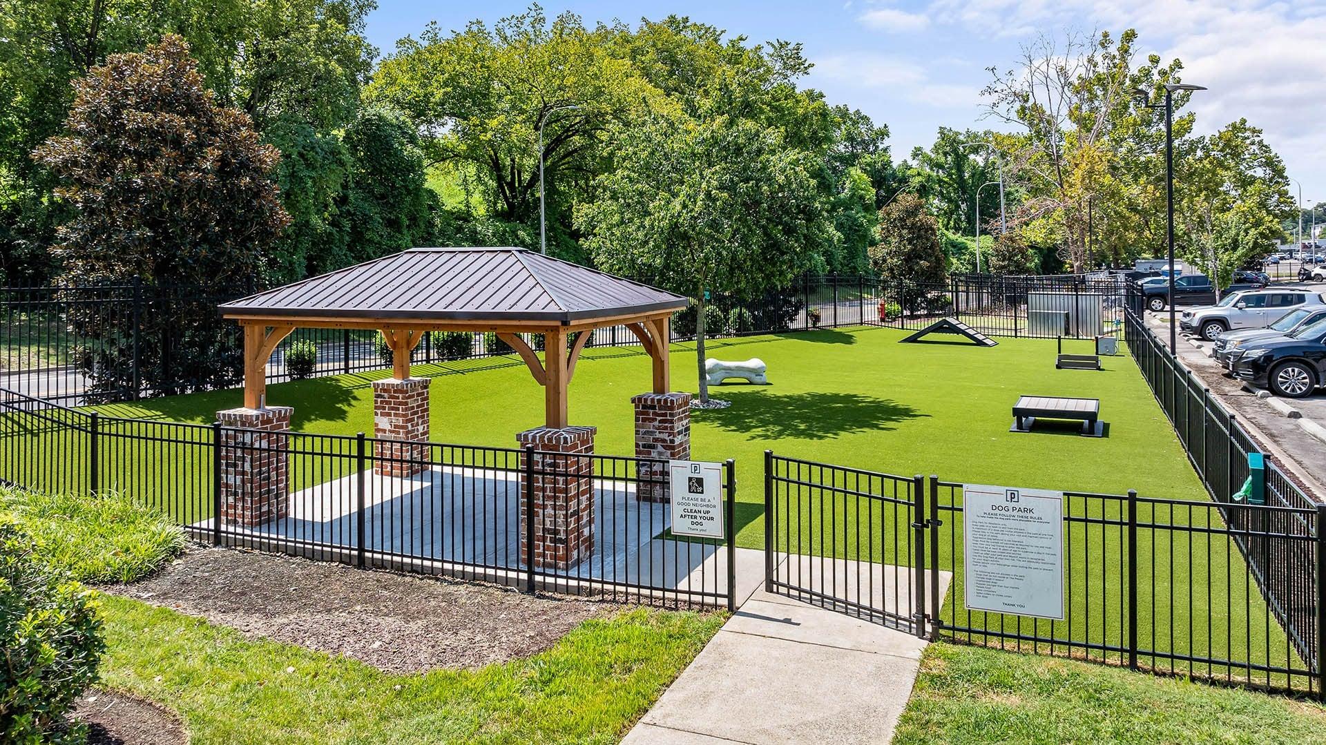 a park with a picnic area and a gazebo