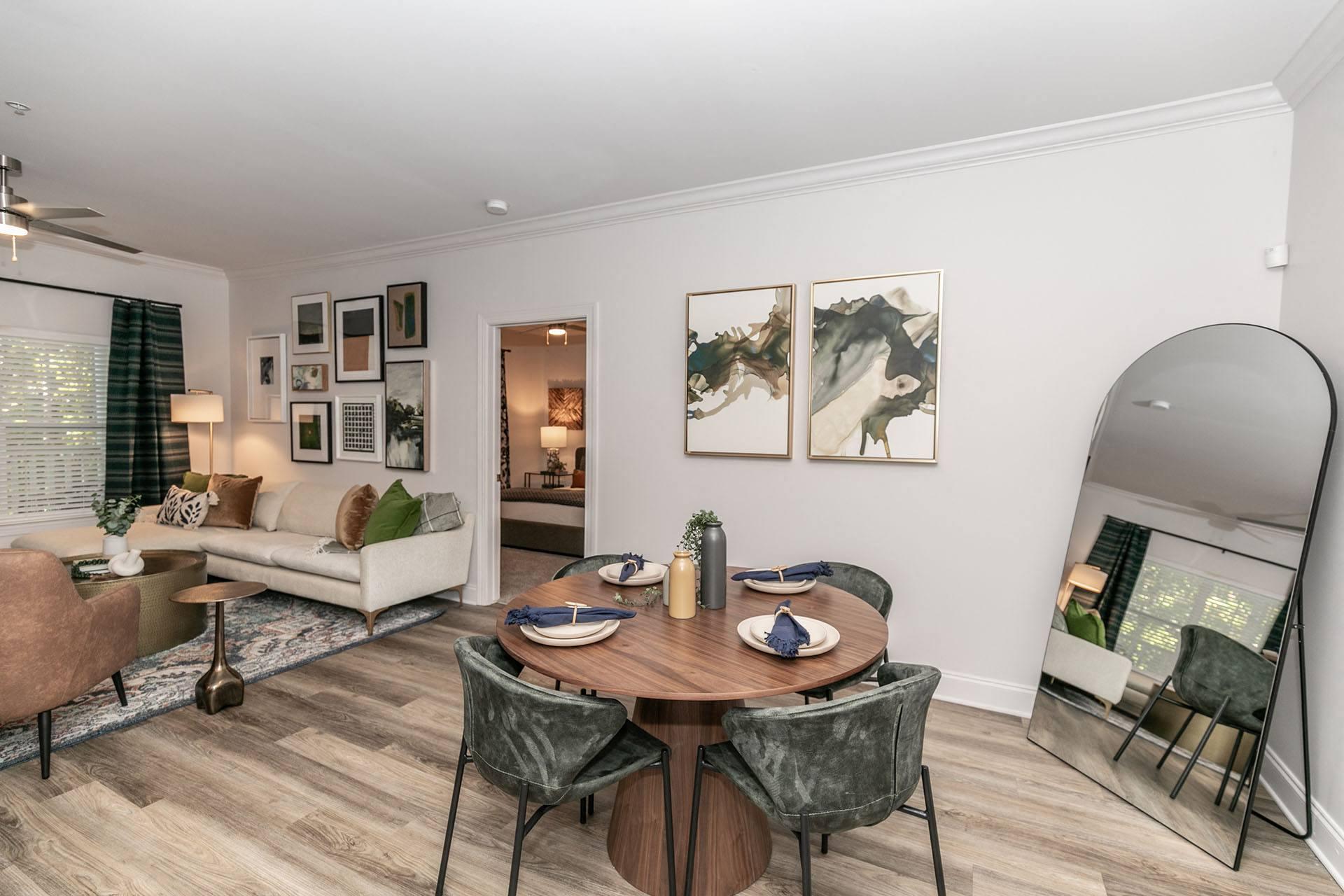 a living room with a dining room table and a couch