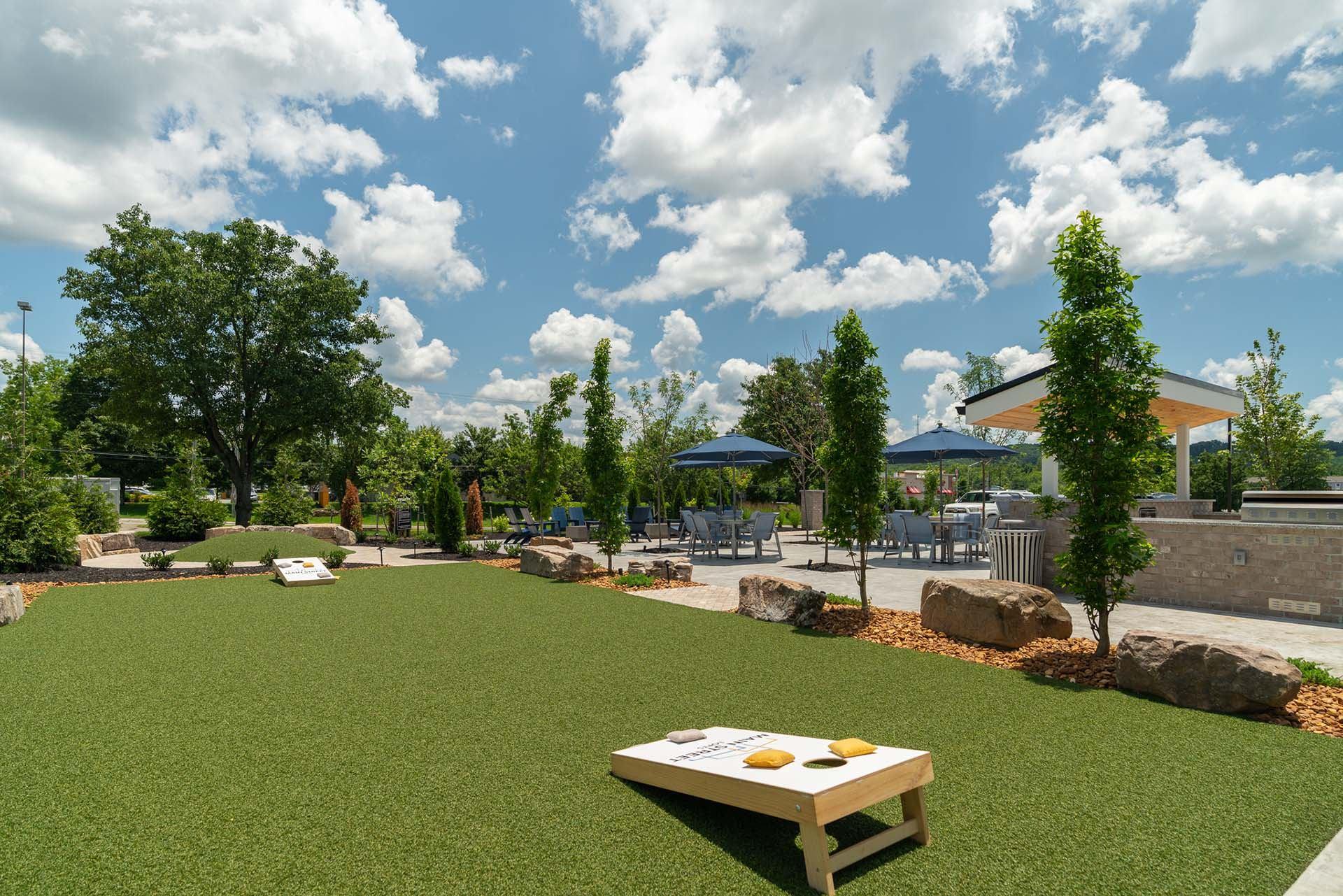 A picnic table is in the middle of a grassy area.