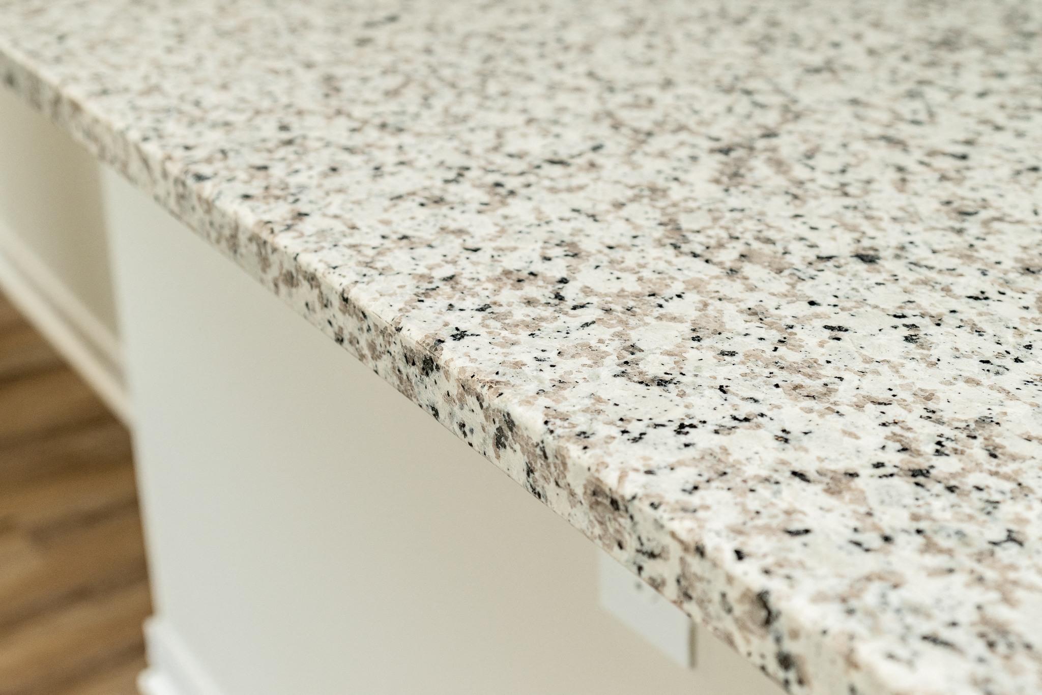 a close up of a granite counter top on a kitchen counter