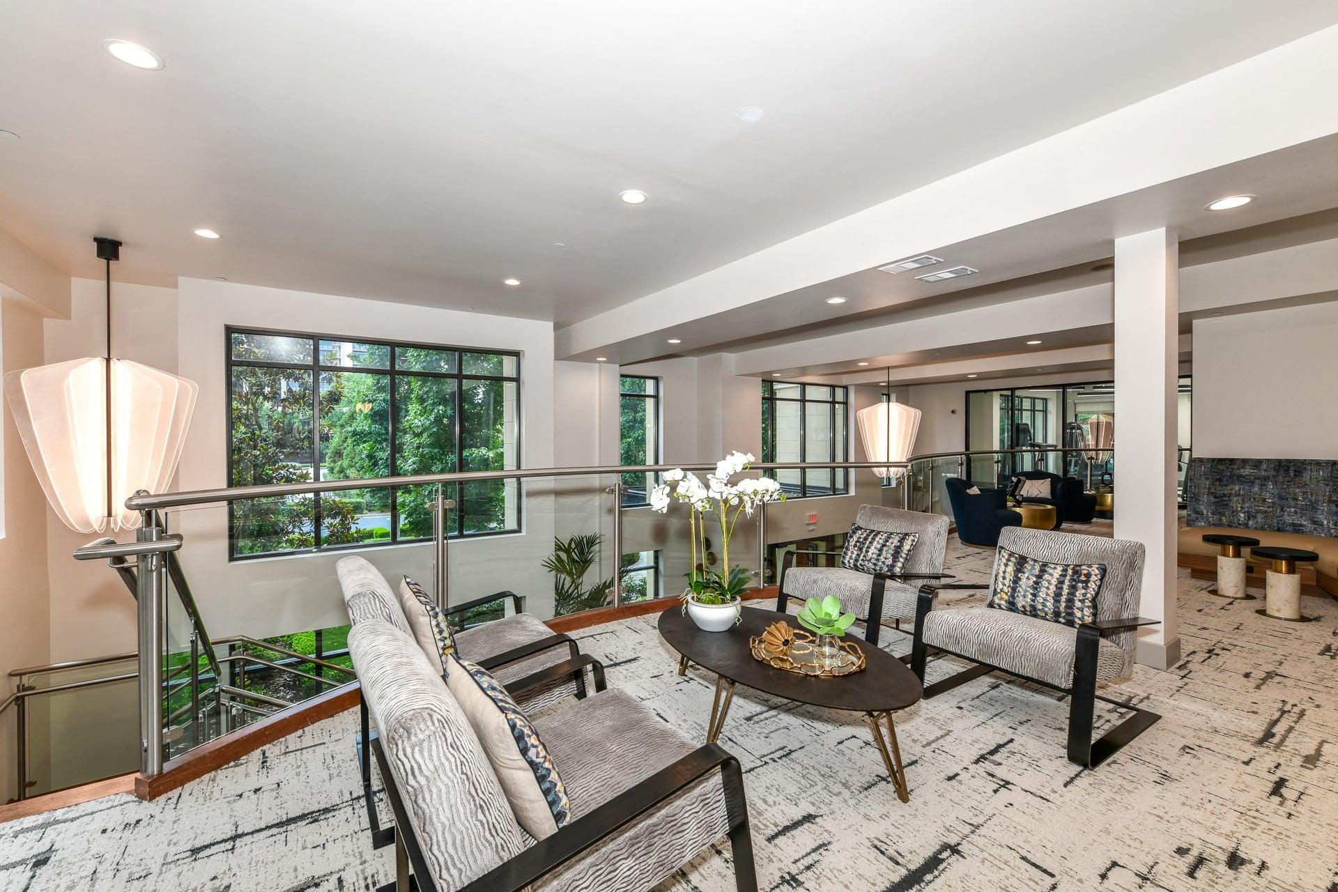 a living room filled with furniture and a large window