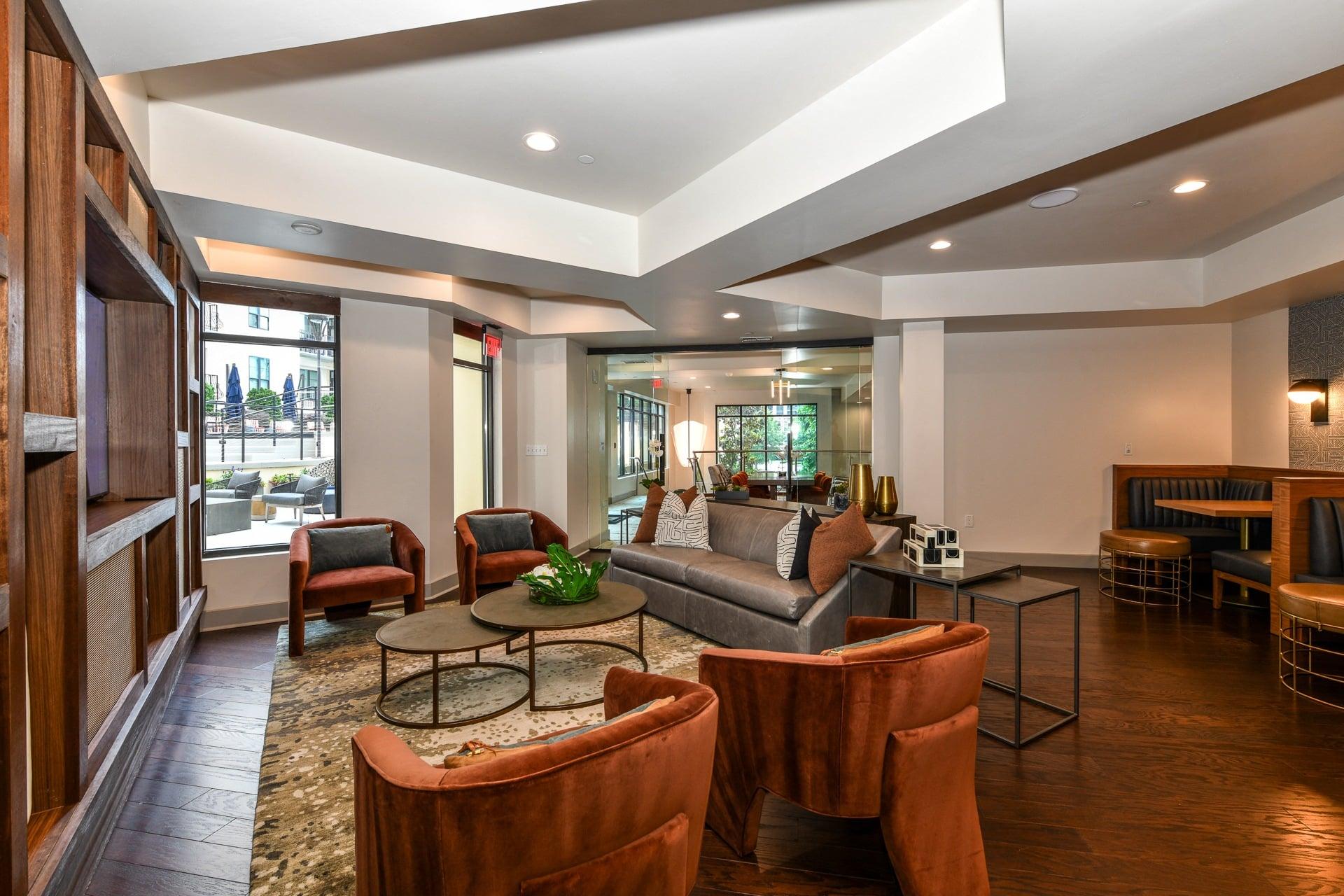 a living room filled with furniture and a large window