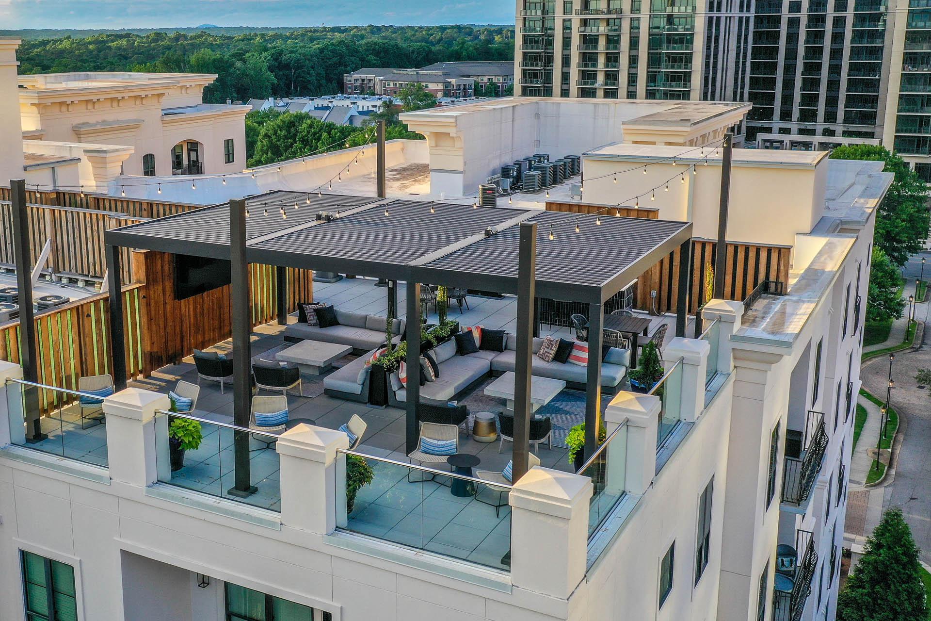 a rooftop patio with a retractable roof